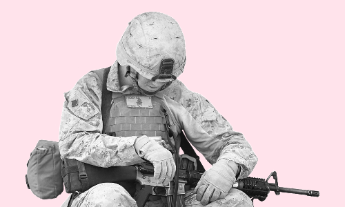 Black and white photo of a soldier looking down where you can't see his face, but instead the top of his head cover, dressed in dessert camo, holding a possible M16, covered in a flak vest. All on a pink background.